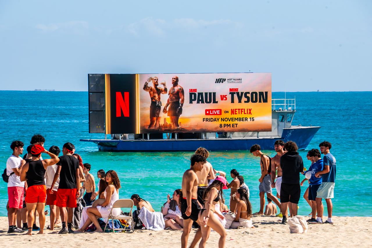 Digital billboard boat with LED display cruising a waterway